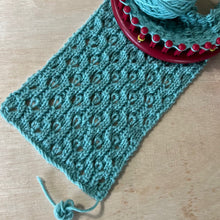 Load image into Gallery viewer, Loom Knit Stitch Hourglass Eyelet on a Large gauge room
