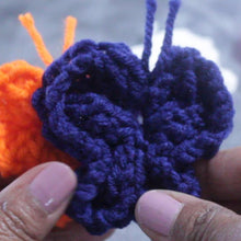 Load image into Gallery viewer, Loom knit tiny butterflies butterfly on a round 24 peg loom Copyright Loomahat