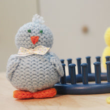 Load image into Gallery viewer, Loom knit tiny chick toy doll project pattern made with a 24 peg circular loom Copyright Loomahat