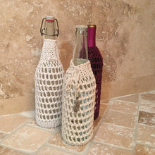 Load image into Gallery viewer, Loom Knit Lace Pattern Wine Bottle Cover Copyright Loomahat 
