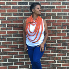 Load image into Gallery viewer, Loom knit scarf cowl pattern. Made on a 24 peg round knitting loom with Red Heart worsted weight yarn Pumpkin. Copyright Loomahat
