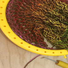 Load image into Gallery viewer, Loom Knit Market Bag Pattern Project. Made on a 41-peg round loom with worsted weight yarn and embroidery floss. Copyright Loomahat