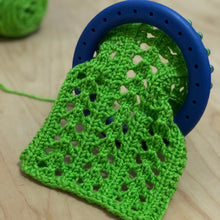 Load image into Gallery viewer, Loom Knit Little Arrowhead Lace Stitch Pattern Small 24-peg  knitting loom. Made wih Red Heart green yarn. Copyright Loomahat Image
