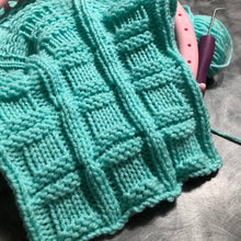 Load image into Gallery viewer, Loom Knit Stitches Button in a Square . Done on a large gauge round knitting loom using Red Heart yarn in Mint.