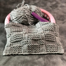 Load image into Gallery viewer, Loom Knit Blocks Stitch Pattern on a Pink Round Knitting Loom with Gray Hook Nook Yarn Copyright Loomahat