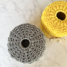 Load image into Gallery viewer, Loom knit toilet pattern cover cozy on a round knitting loom