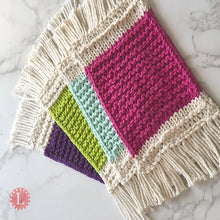 Load image into Gallery viewer, Loom Knit Mug Rug Coaster made with a round 24 peg loom and Peaches and Cream cotton yarn. Copyright Loomahat