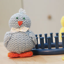 Load image into Gallery viewer, Loom knit tiny chick toy doll project pattern made with a 24 peg circular loom Copyright Loomahat
