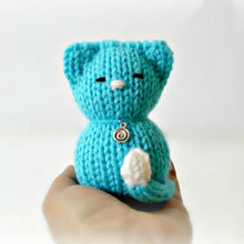 Load image into Gallery viewer, Loom Knit Tiny Kitty Cat Doll Project Pattern on a 24-peg round knitting loom . Made with Red Heart Blue worsted weight scrap yarn . Copyright Loomahat
