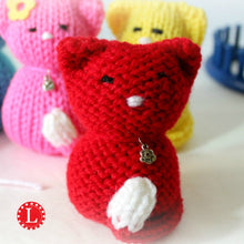 Load image into Gallery viewer, Loom Knit Tiny Kitty Cat Doll Project Pattern on a 24-peg round knitting loom . Made with Red Heart Red worsted weight scrap yarn . Copyright Loomahat
