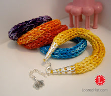 Load image into Gallery viewer, Spool Loom Knit bracelet project pattern. Copyright Loomahat.com
